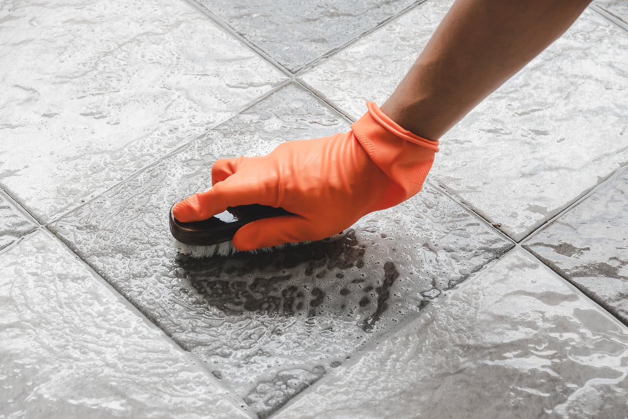 Tile surface being cleaned for color seal service