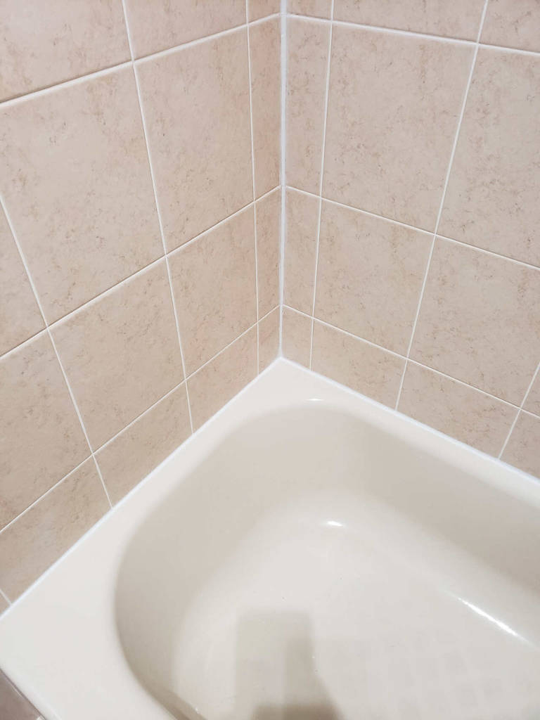 Bathroom wall tiles after re-caulking service