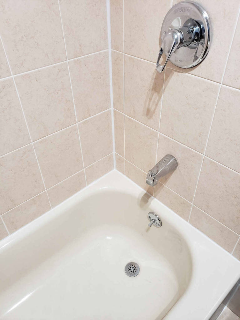 Bathroom wall tiles after re-caulking service