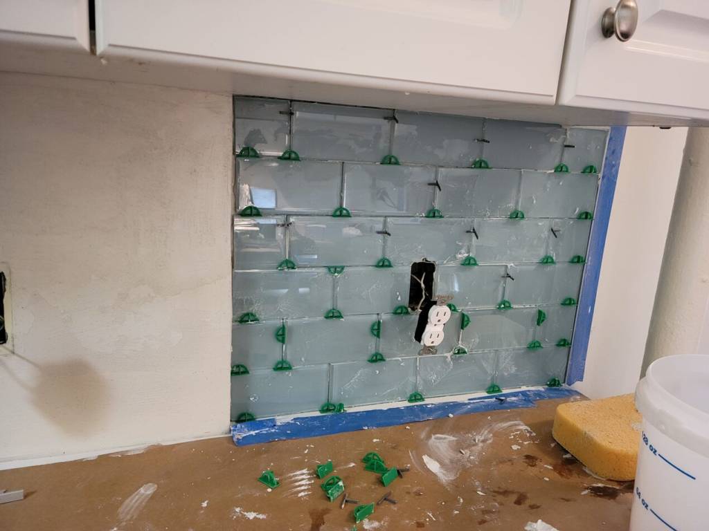 preparing kitchen tile wall for repair and new tile installation